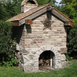 Back of a pizza oven with field stones.