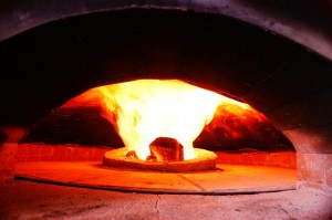 Gas burner in the oven's floor center.