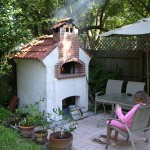 Smoking meats and cooking in outdoors brick oven.