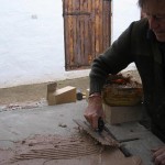 The sand fireclay mixture being trowelled on the slab.