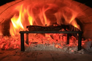 Photo of steak and fire in the oven.