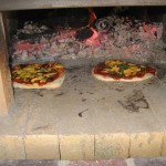 Two pizzas pizza oven.