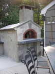 Concrete blocks used for this oven's outer walls. By Joe in Connecticut USA Concrete blocks were used for the oven's outer walls.