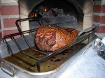 Meat roasts in garden oven