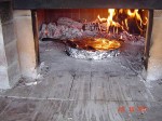 Cooking lasagna in wood burning ovens