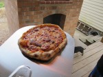 Pizzas cooking and roasting on the wooden floor deck