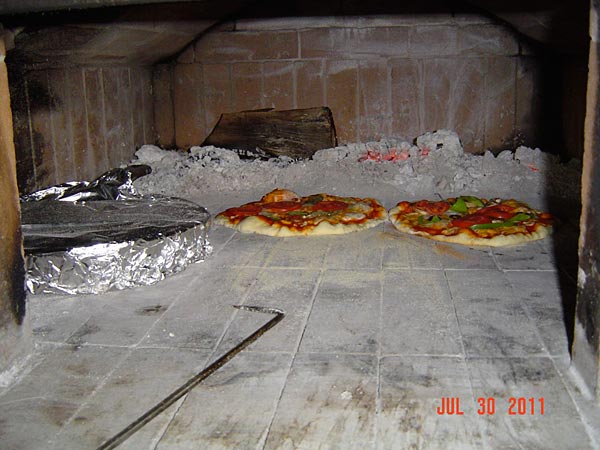 wood burning oven built under roof cover