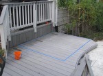 Marking lines for cutting wood deck floor for concrete slab