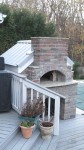 Wooden deck floor with brick oven set in