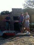 3 mates enjoying brick oven