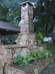 High fireplace chimney beside a roof