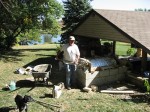 Making concrete cladding, manual hand mixing.