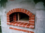 Raw cinder block wall and decorative bricks before stuccoing.