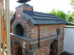 Wood and gas fuel fired brick pizza oven.