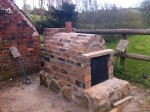 Oven placed on stone base