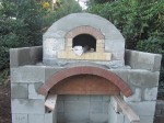 Oven chamber with firebrick which are tapered