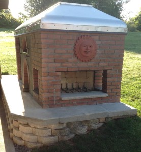 A fireplace with oven and smoker
