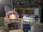 Spherical oven in outside kitchen under roof