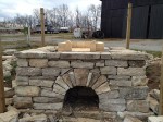 Structure from stones with a hearth on