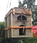 Secured masonry prepared for lifting by crane and transporting by truck